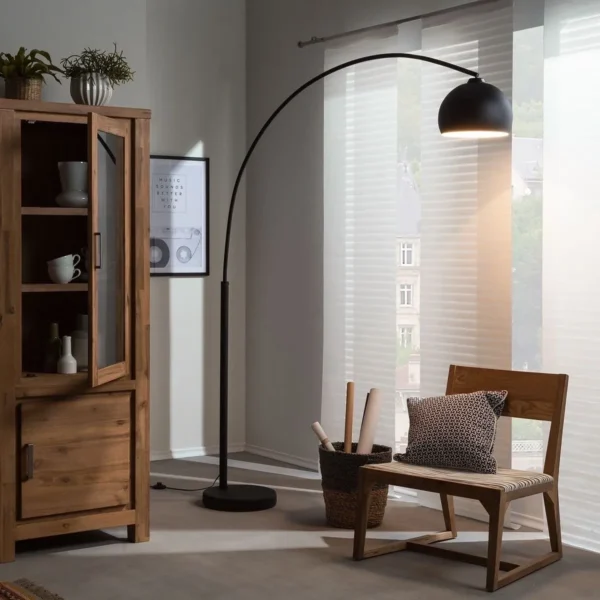 overhead Floor lamp with long bent stand with chair
