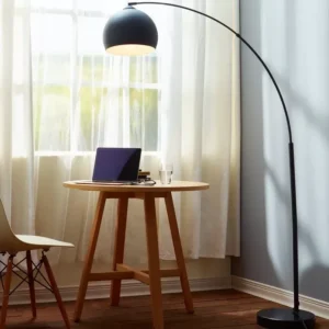 overhead Floor lamp with long bent stand with laptop on table