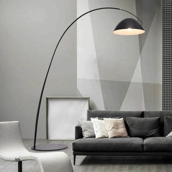 overhead Floor lamp with long bent stand with black couch